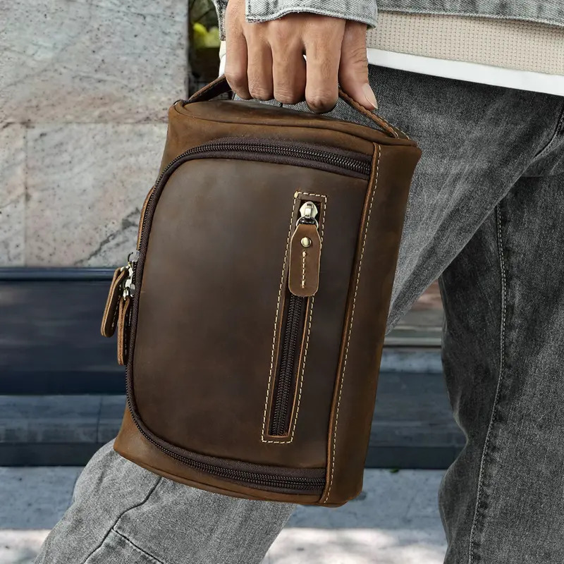 Man holding a retro cowhide bag
